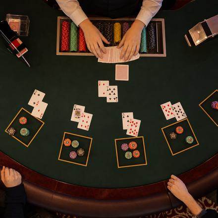 Overhead photo of a blackjack table mid-hand